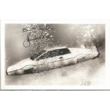 James Bond Roger Moore signed 6 x 4 inch b/w Lotus submarine photo. Good Condition. All