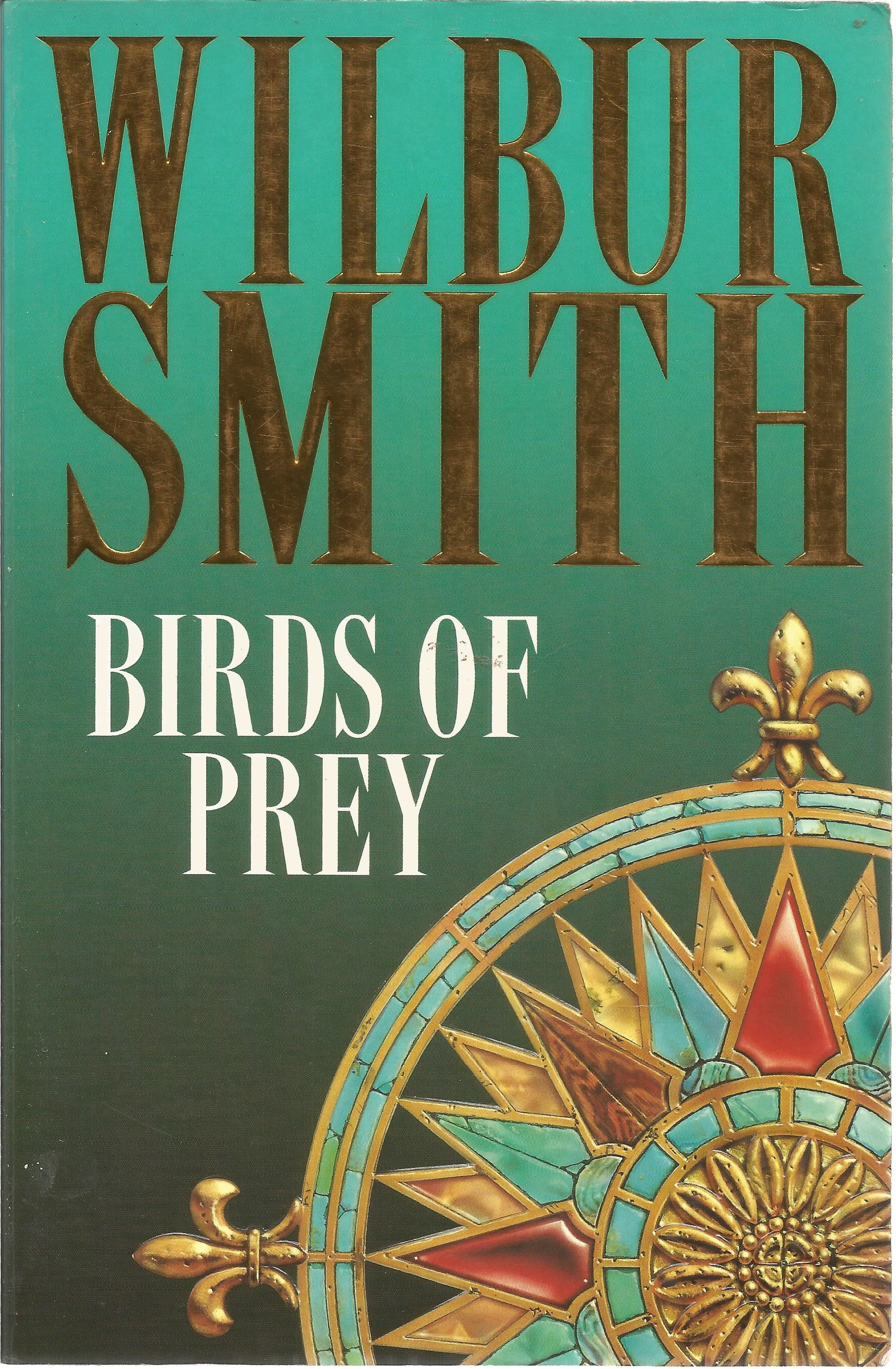 Wilbur Smith signed paperback book titled Birds of Prey signature on an inside page. 554 pages. Good