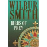 Wilbur Smith signed paperback book titled Birds of Prey signature on an inside page. 554 pages. Good