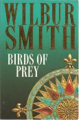 Wilbur Smith signed paperback book titled Birds of Prey signature on an inside page. 554 pages. Good