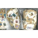 GB stamp collection an accumulation of defs and comms all on paper in three bags a lot of the