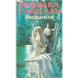 Barbara Cartland signed paperback book titled Enchanted signed on the inside cover. 157 pages.