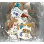 Worldwide stamp collection accumulation all on paper in a bag most items are over 50 years old. Good