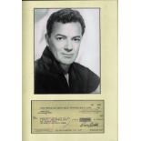 Cornel Wilde signed cheque mounted and framed below black and white photo. October 13, 1912 -