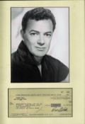 Cornel Wilde signed cheque mounted and framed below black and white photo. October 13, 1912 -