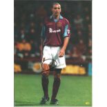 Football Rio Ferdinand signed 12x8 colour magazine photo pictured in action for West Ham United.