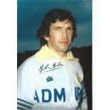 JOHN GILES 1975, football autographed 12 x 8 photo, a superb image depicting the Leeds midfielder