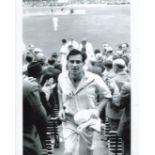 Freddie Truman. 8x10 photo signed by the late Fred Trueman, pictured leaving the field after