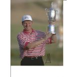 Ernie Els signed 10x8 colour Golf photo, holding trophy aloft. Good Condition. All autographs are