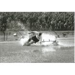 Tom Finney signed 12x8 black and white splash photo. 76 England caps. Good Condition. All autographs