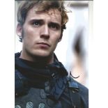 Sam Claflin signed 12x8 colour photo from The Hunger Games. Good Condition. All autographs are