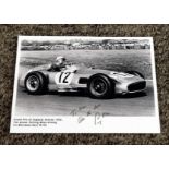 Stirling Moss signed 8x6 black and white photo pictured winning Grand Prix of England Aintree 1955