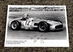 Stirling Moss signed 8x6 black and white photo pictured winning Grand Prix of England Aintree 1955