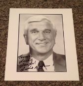 Leslie Nielsen signed 10x8 black and white photo dedicated. Leslie William Nielsen OC (11 February