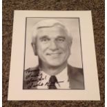 Leslie Nielsen signed 10x8 black and white photo dedicated. Leslie William Nielsen OC (11 February