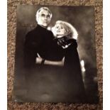 Christopher Lee signed 10x8 black and white pictured with Sybil Danning in the movie The Howling II.