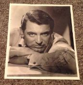 Cary Grant signed 10x8 vintage black and white photo dedicated. Cary Grant (born Archibald Alec