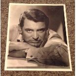 Cary Grant signed 10x8 vintage black and white photo dedicated. Cary Grant (born Archibald Alec