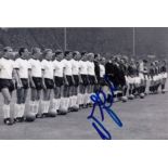 UWE SEELER 1966: Autographed 6 x 4 photo, depicting the West German team standing shoulder to