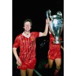 RONNIE WHELAN 1984: Autographed 12 x 8 photo, depicting RONNIE WHELAN parading the European Cup