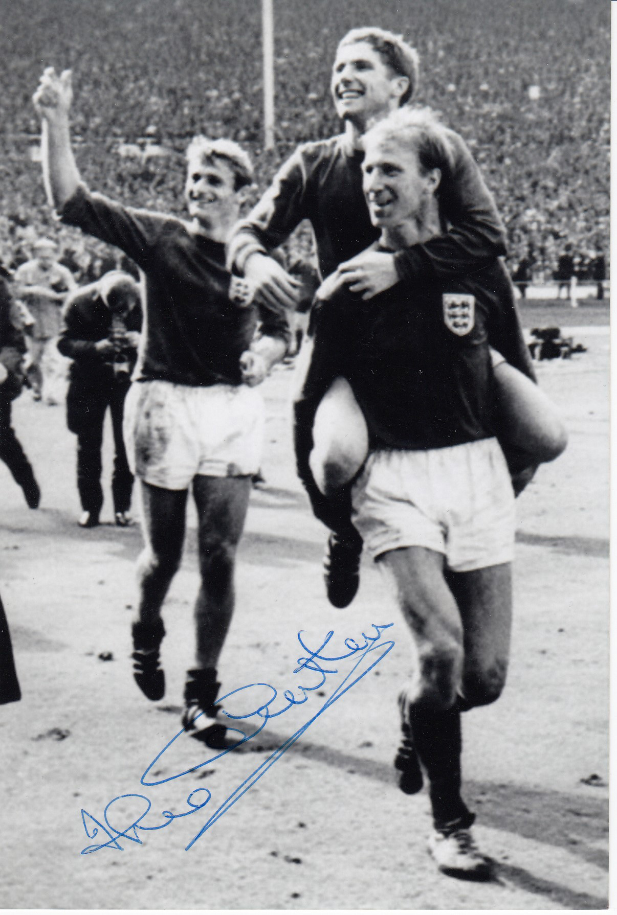 JACK CHARLTON 1966: Autographed 6 x 4 photo, depicting England's Alan Ball on the back of teammate