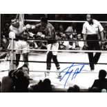 Boxing Larry Holmes signed 16x12 black and white photo pictured during his World Heavyweight title