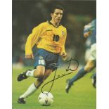 Football Juninho Paulista signed 10x8 magazine photo pictured playing for Brazil. Good Condition.