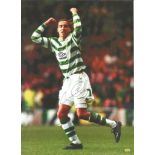 Football Henrik Larsson signed 12x8 colour magazine photo pictured while playing for Celtic. Good