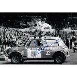 DUNCAN McKENZIE 1976: Autographed 12 x 8 photo, depicting Leeds United's DUNCAN McKENZIE jumping