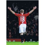 PAUL SCHOLES 2009: Autographed 16 x 12 photo, depicting Manchester United's PAUL SCHOLES, arms aloft