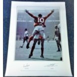 Football Geoff Hurst and Martin Peters signed 33x16 colourised print picturing the two celebrating