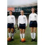 JACK CHARLTON 1965: Autographed 6 x 4 photo, depicting England's JACK CHARLTON, brother Bobby and