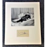 Marlene Dietrich signature piece, mounted below black and white photo. Approx overall size 17x14.