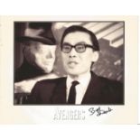 Burt Kwouk signed 10x8 black and white Avengers photo. Good Condition. All autographs are genuine