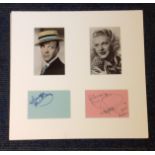 Fred Astaire and Ginger Rogers signature pieces mounted below vintage photos. Approx overall size