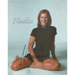 Nadia Comaneci signed 10x8 colour photo. Gymnast. Good Condition. All autographs are genuine hand