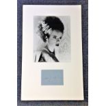 Elsa Lanchester signature piece mounted below black and white photo. Approx overall size 20x14. Good