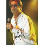 Huey Lewis music signed 10 x 8 inch colour photo performing on stage. Good Condition. All autographs