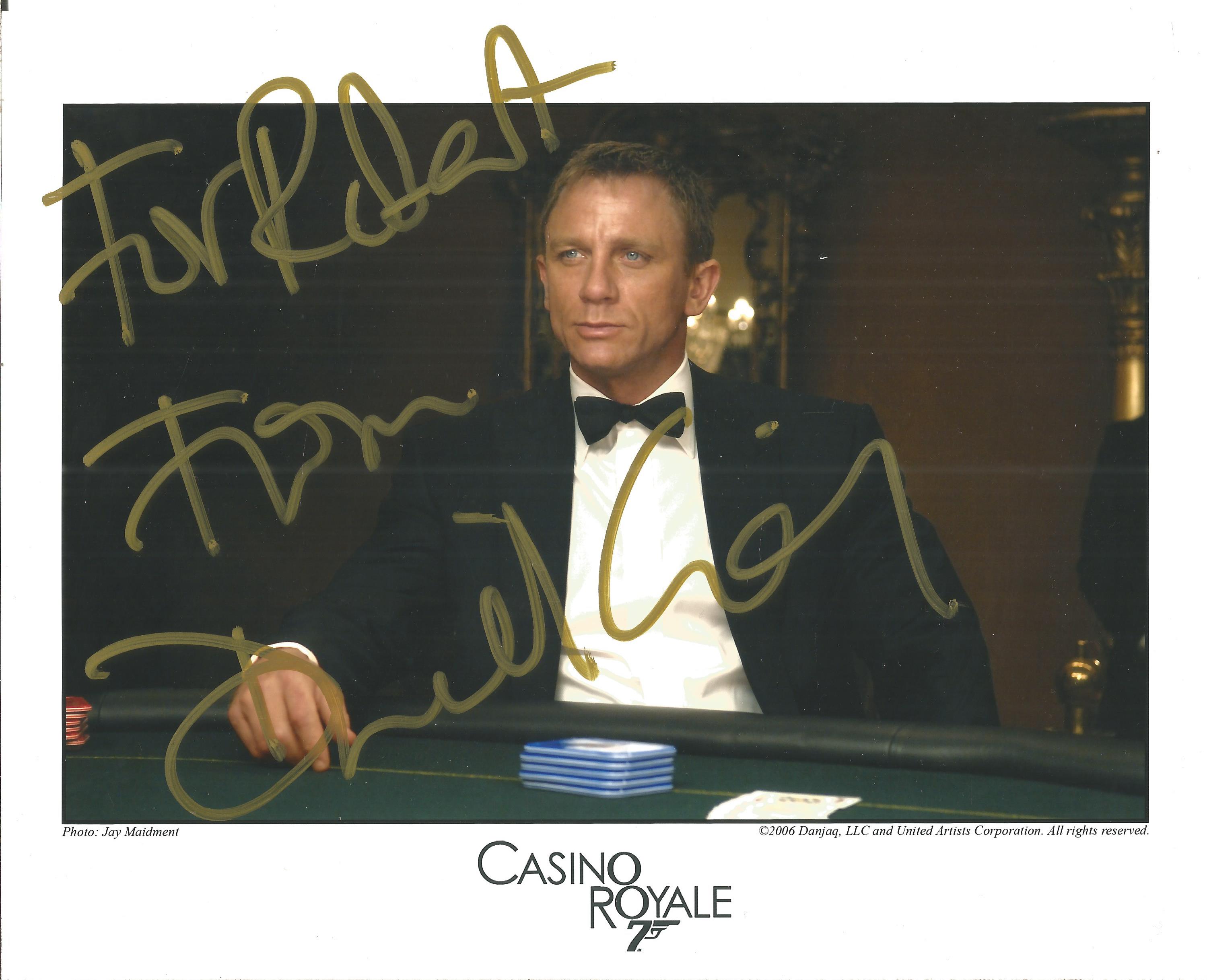Daniel Craig signed 10x8 Casino Royale colour photo. Dedicated. Craig achieved international fame