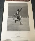 George Best signed 16 x 12 inch b/w print of his goal celebration at 1968 Cup Final.