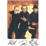 Bee Gees signature pieces stuck below colour photo of the 3 brothers. The Bee Gees were a music