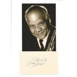 Sidney Bechet signature piece stuck below black and white photo. (May 14, 1897 - May 14, 1959) was