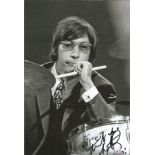 Charlie Watts signed 12x8 black and white photo. Slightly smudged, possible dedication removed.