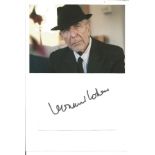 Leonard Cohen signed 6x4 white card stuck below colour photo. (September 21, 1934 - November 7,
