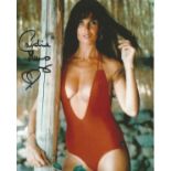 007 Bond girl. The Spy Who Loved Me actress Caroline Munro signed 8x10 photo in sexy red swimsuit.