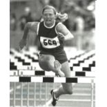 MARY PETERS signed Olympic Athletics 8x10 Photo. All autographs come with a Certificate of