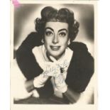 Joan Crawford signed 10x8 vintage photo. Small amount of paper stuck to top left hand corner and rip