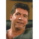 Simon Cowell signed 12x8 colour photo. English television personality, entrepreneur, entertainment