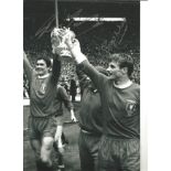 Ron Yates and Roger Hunt Liverpool Signed 12 x 8 inch football photo. Good Condition. All autographs