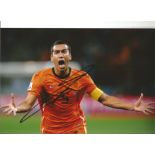 Giovanni Van Bronckhorst Holland Signed 10 x 8 inch football photo. Good Condition. All autographs